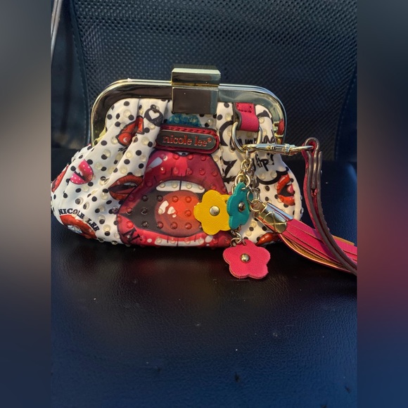 Nicole Lee Handbags - Nicole lee coin purse with designs has flower charms and hand holder